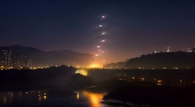 现代都市夜景，成人都市有声小说，高楼霓虹灯倒影在雨后街道，商务男主角形象